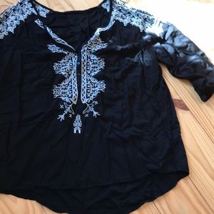 Black blouse with white stitching